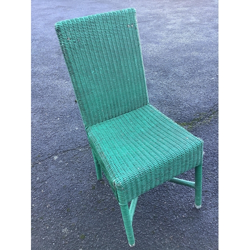 196 - A weathered teak garden table, width 180cm, depth 99cm, height 75cm and eleven Habitat wicker chairs... 