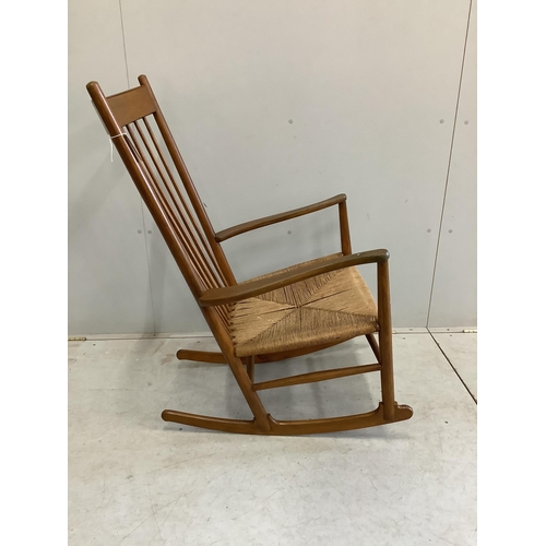 20 - A Hans Wegner style rocking chair, width 63cm, height 106cm. Condition - fair