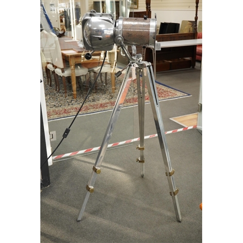 55 - A vintage 'Strand Electric' studio lamp on an adjustable tripod, height 132cm. Condition - fair... 