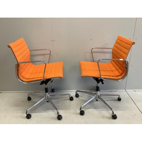 56 - A pair of Vitra Eames EA117 orange fabric office chairs, width 57cm, depth 52cm, height 89cm. Condit... 