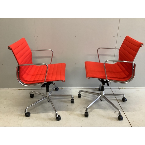 58 - A pair of Vitra Eames EA117 red fabric office chairs, width 57cm, depth 52cm, height 83cm. Condition... 