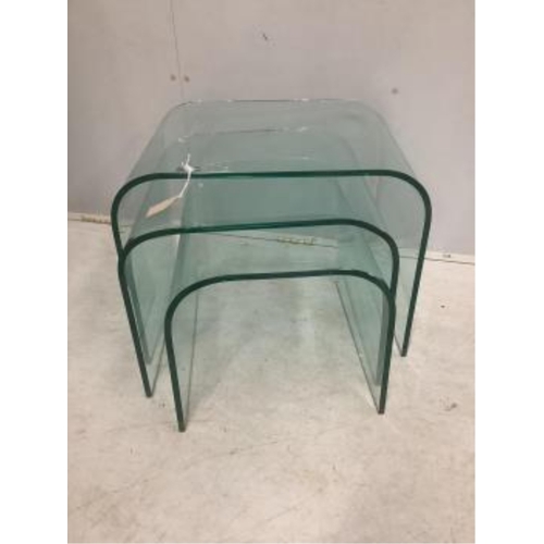 64 - A nest of three Contemporary curved glass tables, width 59cm, depth 44cm, height 45cm. Condition - g... 