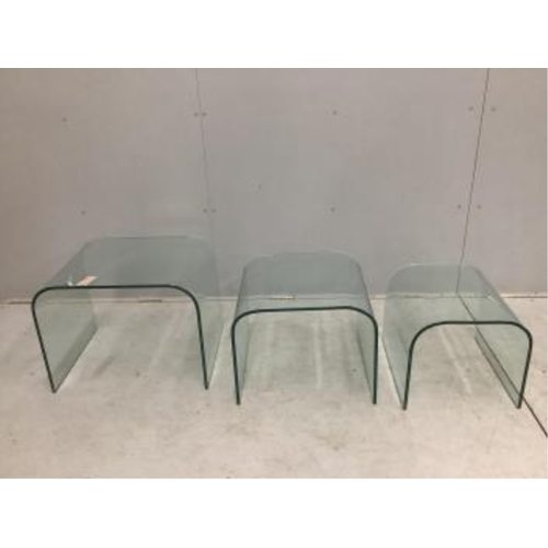 64 - A nest of three Contemporary curved glass tables, width 59cm, depth 44cm, height 45cm. Condition - g... 