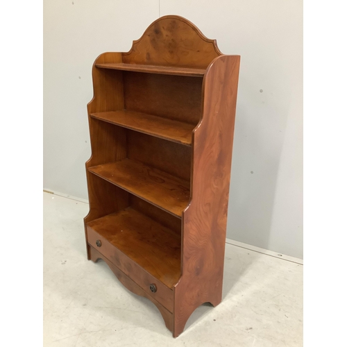 93 - A reproduction elm graduated open bookcase, width 70cm, height 121cm. Condition - fair to good... 