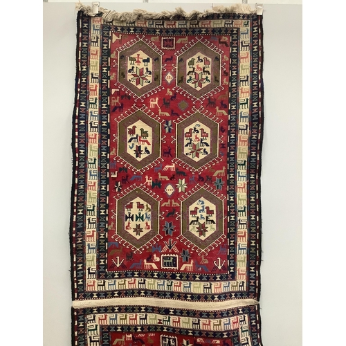 1015 - A Soumak flatweave rug, approximately 320 x 108cm. Condition - good