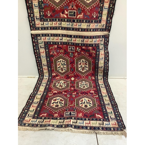 1015 - A Soumak flatweave rug, approximately 320 x 108cm. Condition - good