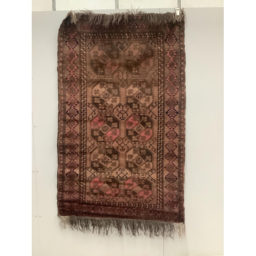 1052 - An Afghan red ground rug, 190 x 120cm. Condition - fair