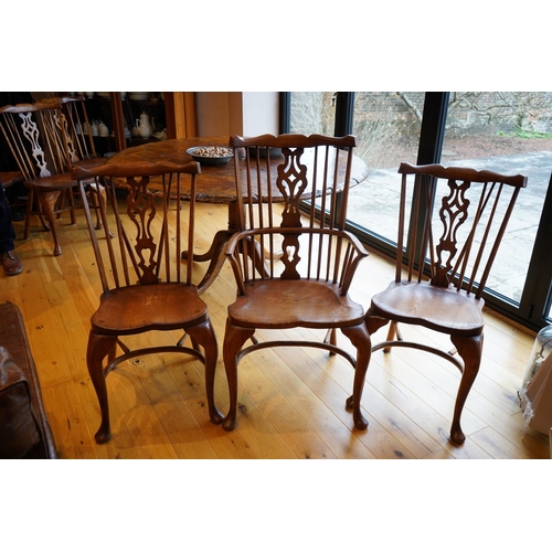 1108 - A set of six Titchmarsh & Goodwin elm Windsor chairs, two with arms. Condition - fair to good