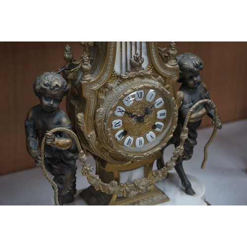 1618 - A gilt metal and marble clock garniture, with key, 61cm. Condition - fair/good