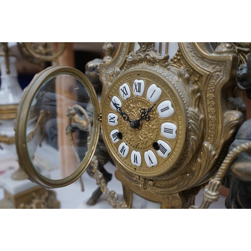 1618 - A gilt metal and marble clock garniture, with key, 61cm. Condition - fair/good