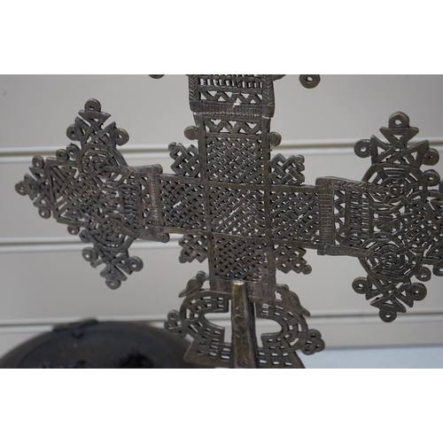 1643 - An Ethiopian Coptic processional cross, two Indian brass betel nut boxes together with other metalwa... 