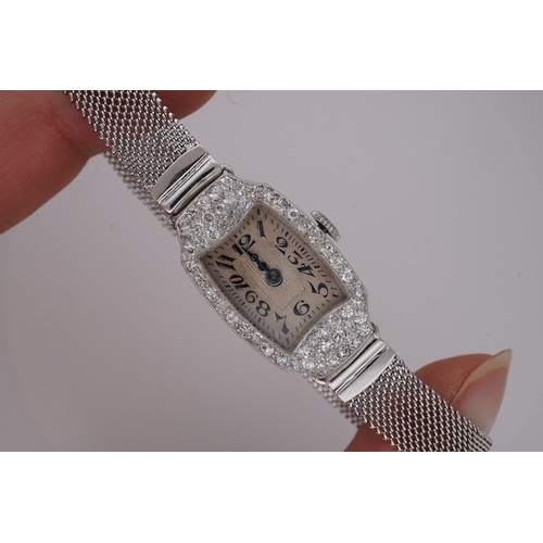 1923 - A lady's mid 20th century Swiss white metal(platinum mark) and diamond set cocktail watch with 'tumb... 