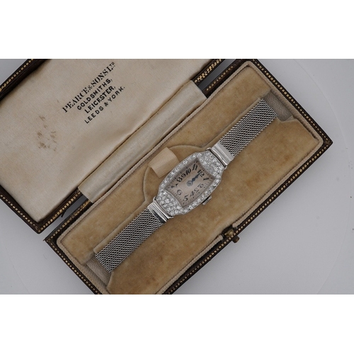 1923 - A lady's mid 20th century Swiss white metal(platinum mark) and diamond set cocktail watch with 'tumb... 