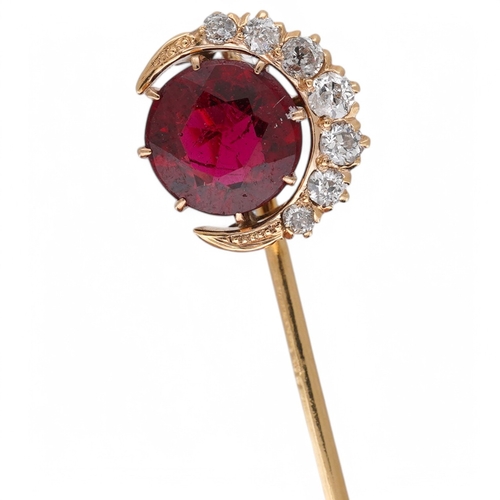 1925 - An early to mid 20th century yellow metal and single stone garnet topped doublet set stick pin, with... 