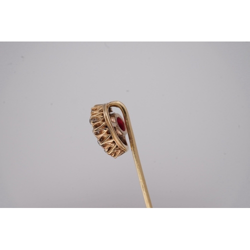 1925 - An early to mid 20th century yellow metal and single stone garnet topped doublet set stick pin, with... 