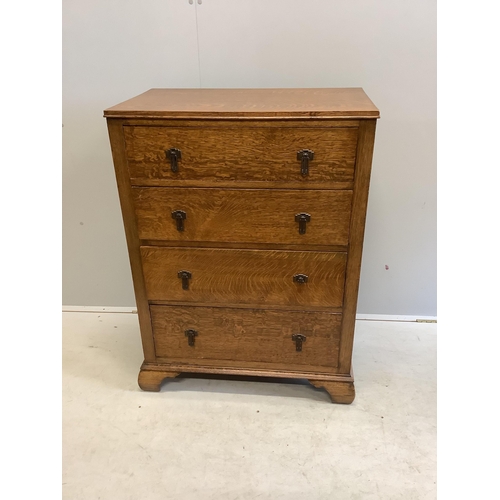 22 - An early 20th century oak chest of four drawers, width 76cm, depth 46cm, height 104cm. Condition - g... 