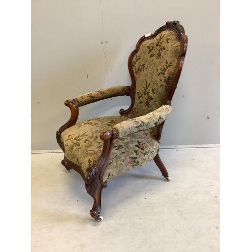 27 - A Victorian walnut upholstered open armchair, width 66cm, depth 60cm, height 100cm. Condition - good... 