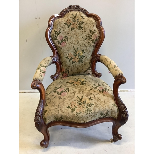 27 - A Victorian walnut upholstered open armchair, width 66cm, depth 60cm, height 100cm. Condition - good... 