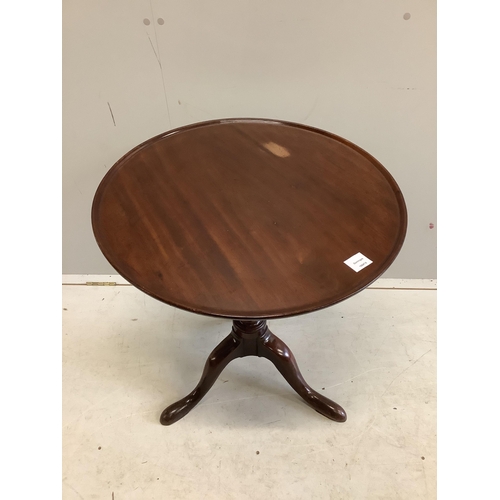 28 - A George III circular mahogany tilt top tripod tea table, diameter 63cm, height 69cm. Condition - fa... 