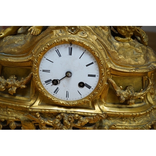 398 - An early 20th century French ormolu clock surmounted with a boy and dog, striking on a bell, 41cm wi... 