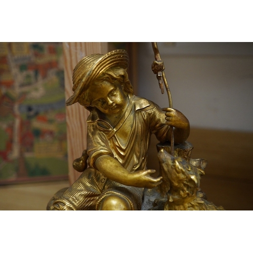 398 - An early 20th century French ormolu clock surmounted with a boy and dog, striking on a bell, 41cm wi... 