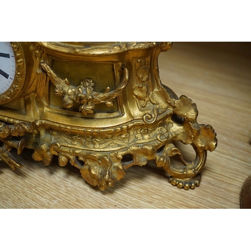 398 - An early 20th century French ormolu clock surmounted with a boy and dog, striking on a bell, 41cm wi... 