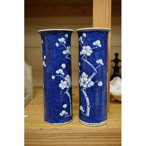 404 - A pair of Chinese prunus flower sleeve vases, 21cm high. Condition - cracked