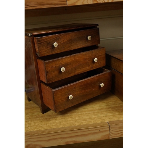 406 - A small 19th century mahogany chest of three drawers having bone handles, width 26cm, height 26cm an... 