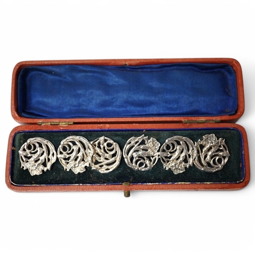 442 - An Edwardian cased set of 6 Art Nouveau silver buttons, cast with stylised scrolling flowers, James ... 