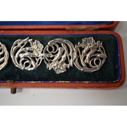 442 - An Edwardian cased set of 6 Art Nouveau silver buttons, cast with stylised scrolling flowers, James ... 