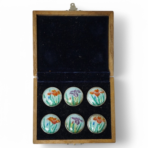 448 - An early 20th century cased set of 6 Japanese white metal buttons, enamelled with irises, 22mm. Cond... 