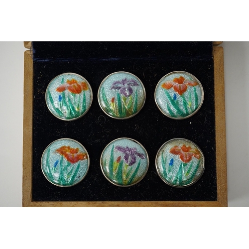 448 - An early 20th century cased set of 6 Japanese white metal buttons, enamelled with irises, 22mm. Cond... 