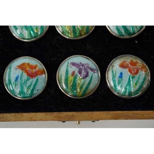 448 - An early 20th century cased set of 6 Japanese white metal buttons, enamelled with irises, 22mm. Cond... 