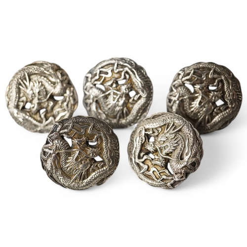 461 - A set of 5 early 20th century Japanese white metal buttons decorated with dragons, 24mm. Condition -... 