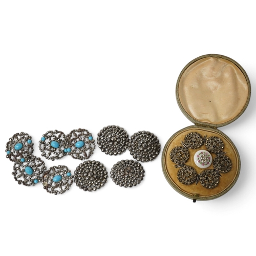 462 - An Edwardian cased set of 6 cut steel buttons with central floral motifs, 20mm, a paste inset cerami... 