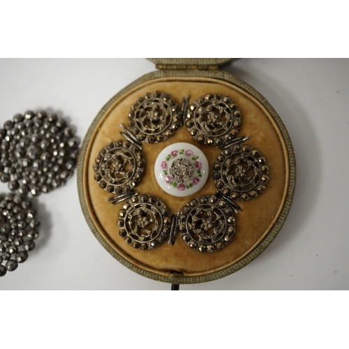 462 - An Edwardian cased set of 6 cut steel buttons with central floral motifs, 20mm, a paste inset cerami... 