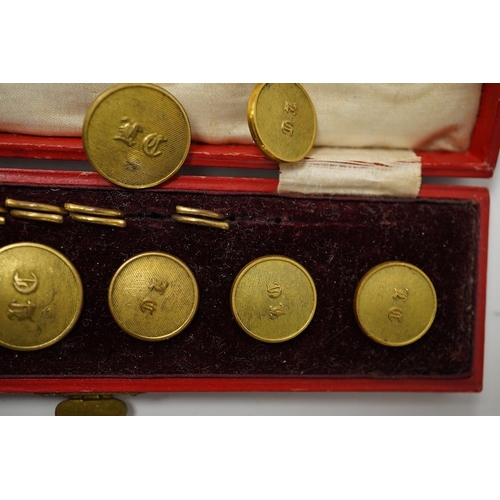 464 - A set of 22 late 19th century gilt brass 'M.C.' (Merton College, Oxford) buttons. Condition - good i... 