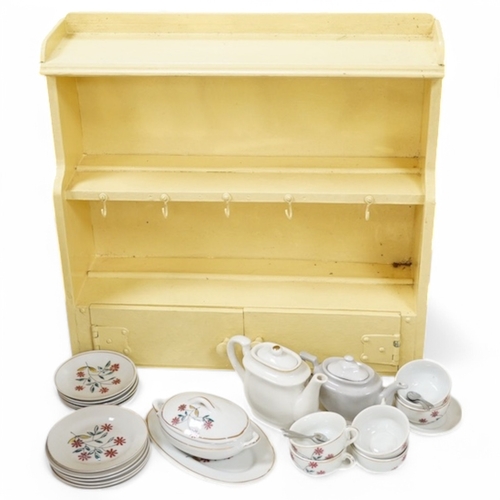 475 - A 1930's handmade painted toy dresser with a miniature dinner service stamped Foreign to the bases... 