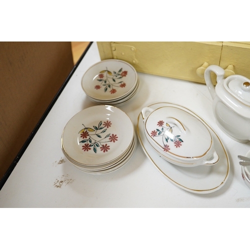 475 - A 1930's handmade painted toy dresser with a miniature dinner service stamped Foreign to the bases... 