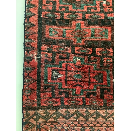 62 - A saddlebag sampler carpet, 222 x 92cm. Condition - fair