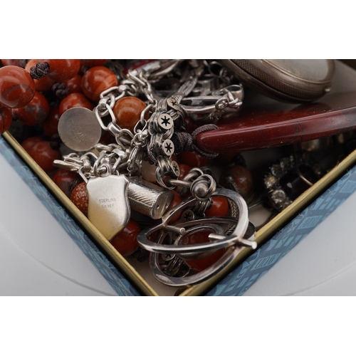 941 - A mixed group of silver jewellery, including two charm bracelets, an Art Nouveau-style pendant; a po... 