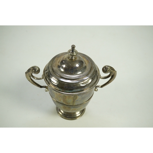 1 - A George I Irish silver two handled cup by Philip Kinnersley, Dublin, 1719, with an earlier Queen An... 