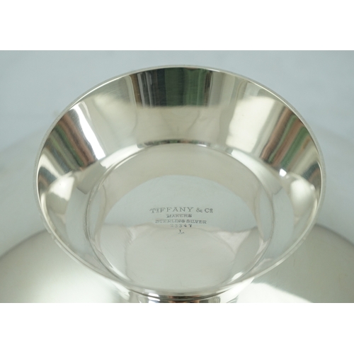 103 - A stylish mid 20th century Tiffany & Co. sterling silver two handled dish, of oval boat shape, with ... 