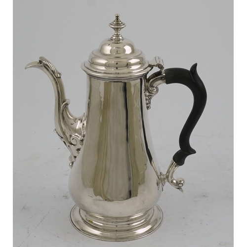 11 - A late George II silver coffee pot, by William & Robert Peaston, of baluster form, with engraved arm... 