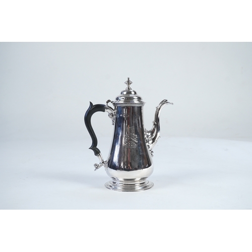 11 - A late George II silver coffee pot, by William & Robert Peaston, of baluster form, with engraved arm... 