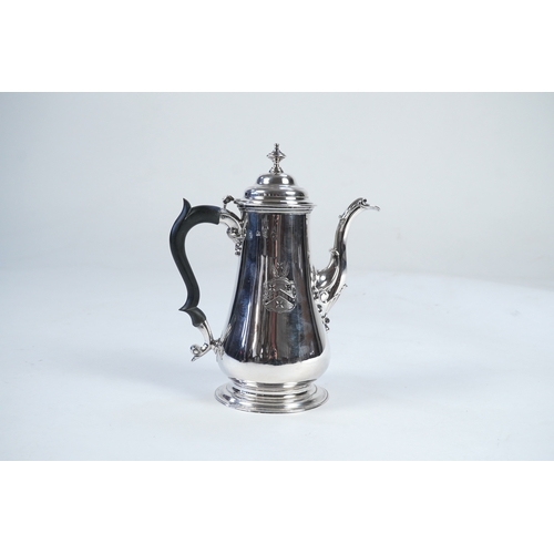 11 - A late George II silver coffee pot, by William & Robert Peaston, of baluster form, with engraved arm... 