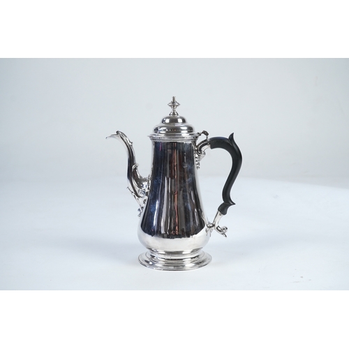 11 - A late George II silver coffee pot, by William & Robert Peaston, of baluster form, with engraved arm... 