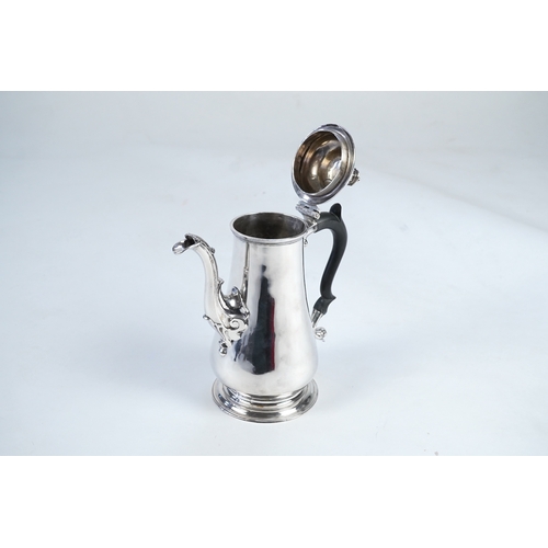 11 - A late George II silver coffee pot, by William & Robert Peaston, of baluster form, with engraved arm... 