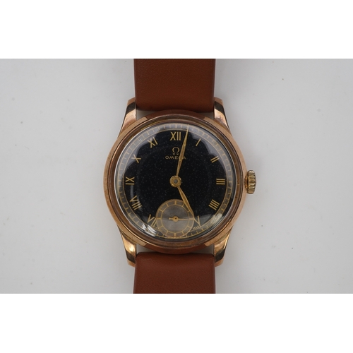 122 - A gentleman's 1940's 9ct gold Omega manual wind wrist watch, on a later associated leather strap, wi... 