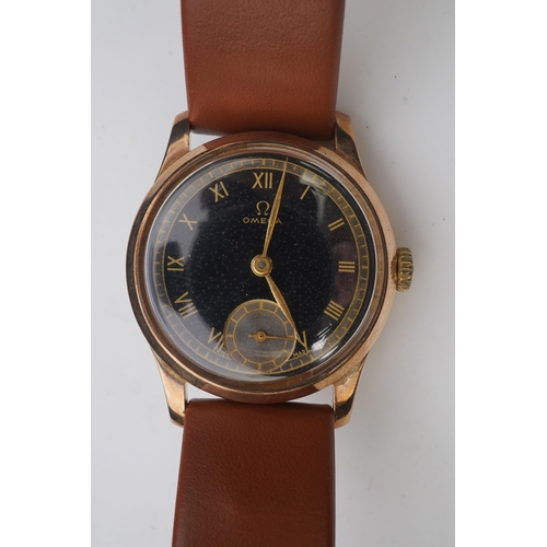 122 - A gentleman's 1940's 9ct gold Omega manual wind wrist watch, on a later associated leather strap, wi... 